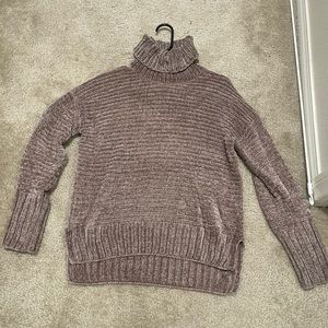Ribbed tan turtle neck sweater. Longer in back. Size small. Worn once.